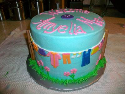 picture of blue baby clothesline cake