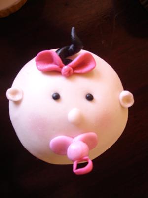 picture of pink baby face cupcakes for a girl