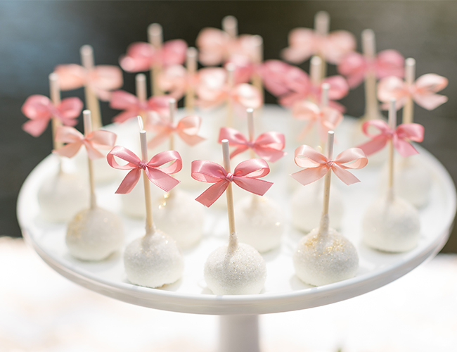 bow themed baby shower cake pops for a girl