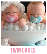 banner of twin baby shower cakes and cupcakes