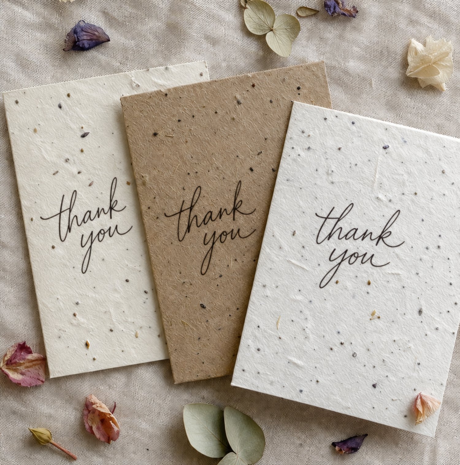 Seed-embedded plantable paper thank-you cards in cream and kraft tones for eco-friendly locally grown shower favors