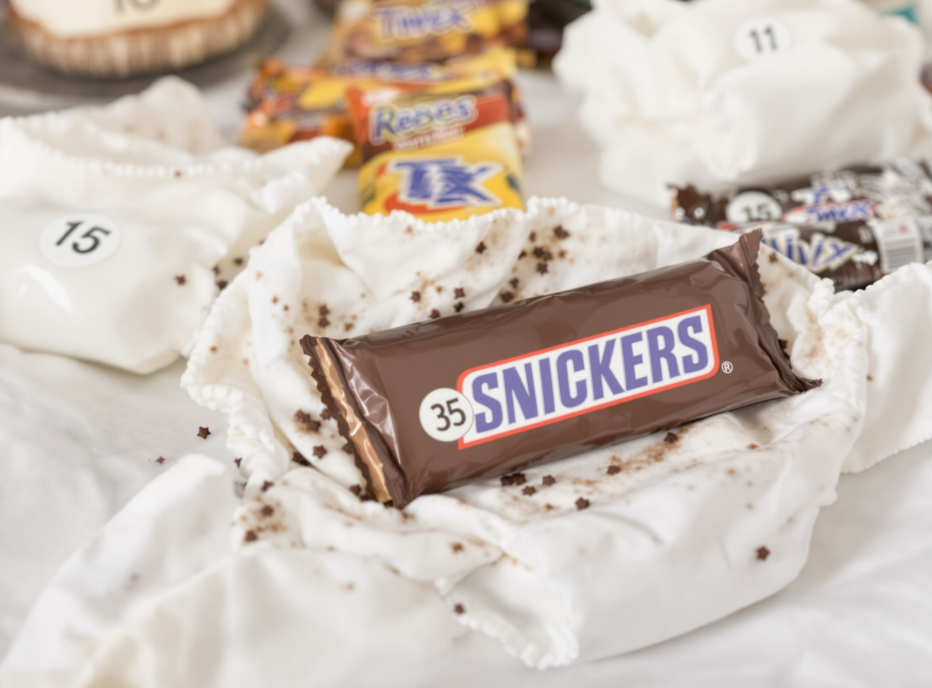 candy bar diaper baby shower game - guests guess which chocolate bar is melted in each diaper