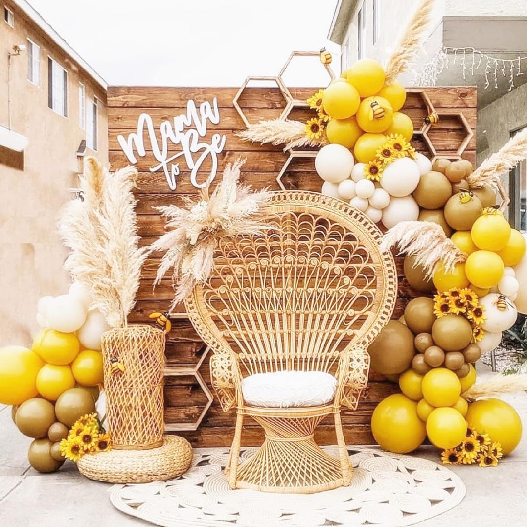 yellow themed baby shower balloon arch